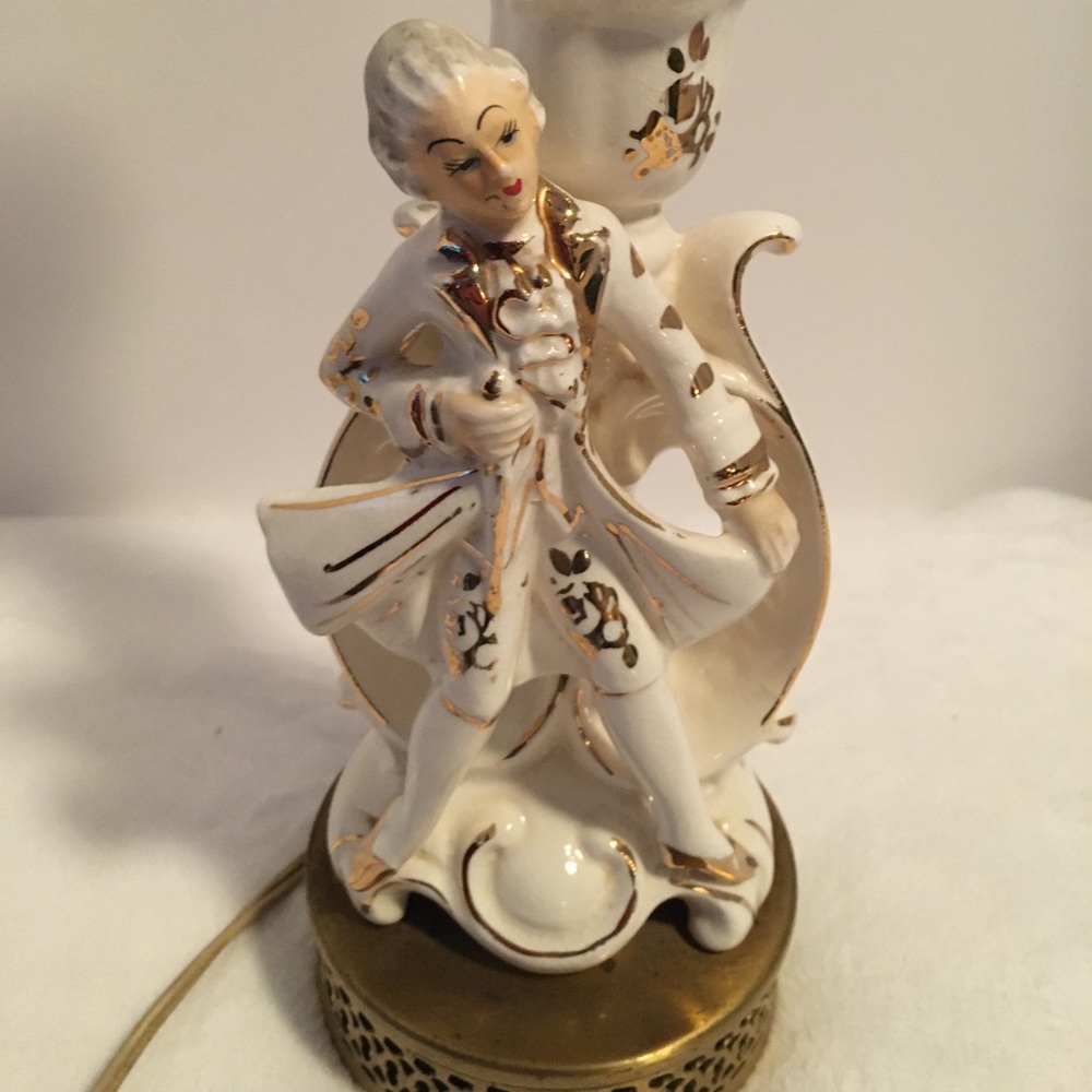 Porcelain cream with gold accents figural male with Victorian attire lamp